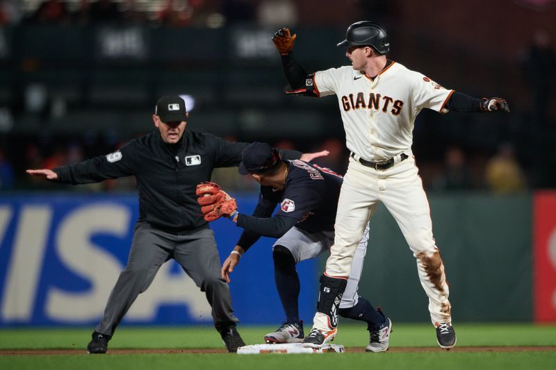 Sep 11, 2023; San Francisco, California, USA; Umpire Brock Ballou (119) makes the safe sign after San Francisco Giants outfielder Mike Yastrzemski (5) slid into second base against Cleveland Guardians infielder Andres Gimenez (0) during the fifth inning at Oracle Park. Mandatory Credit: Robert Edwards-USA TODAY Sports