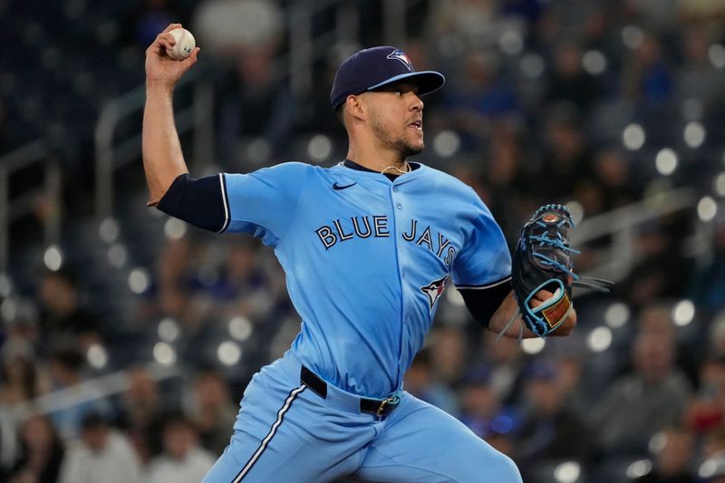 May 29, 2025; Toronto, Ontario, CAN; Toronto Blue Jays starting pitcher Jose Berrios (17) pitches to the Athletics  during the first inning at Rogers Centre. Mandatory Credit: John E. Sokolowski-Imagn Images