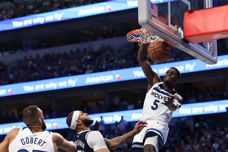 DALLAS, TEXAS - MAY 26: Anthony Edwards #5 of the Minnesota Timberwolves dunks the ball against the Dallas Mavericks during the third quarter in Game Three of the Western Conference Finals at American Airlines Center on May 26, 2024 in Dallas, Texas. NOTE TO USER: User expressly acknowledges and agrees that, by downloading and or using this photograph, User is consenting to the terms and conditions of the Getty Images License Agreement. (Photo by Matthew Stockman/Getty Images)