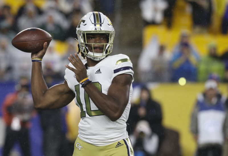 Oct 1, 2022; Pittsburgh, Pennsylvania, USA;  Georgia Tech Yellow Jackets quarterback Jeff Sims (10) throws a pass against the Pittsburgh Panthers during the first quarter at Acrisure Stadium. Mandatory Credit: Charles LeClaire-USA TODAY Sports