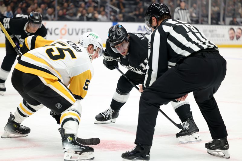 Jan 20, 2025; Los Angeles, California, USA;  Los Angeles Kings center Anze Kopitar (11) and Pittsburgh Penguins center Noel Acciari (55) face off during the second period at Crypto.com Arena. Mandatory Credit: Kiyoshi Mio-Imagn Images