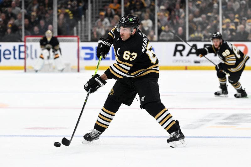 Feb 10, 2024; Boston, Massachusetts, USA; Boston Bruins left wing Brad Marchand (63) takes a shot against the Washington Capitals during the third period at the TD Garden. Mandatory Credit: Brian Fluharty-USA TODAY Sports