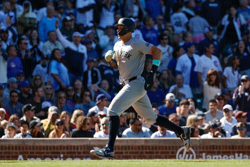 Sep 7, 2024; Chicago, Illinois, USA; New York Yankees outfielder Aaron Judge (99) runs to score against the Chicago Cubs during the sixth inning at Wrigley Field. Mandatory Credit: Kamil Krzaczynski-Imagn Images