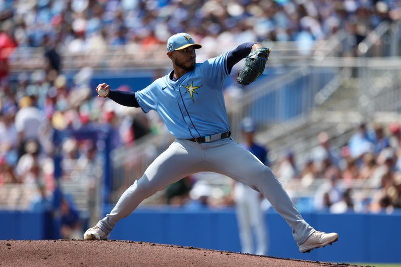 Mar 20, 2025; Dunedin, Florida, USA; Tampa Bay Rays pitcher Taj Bradley (45) throws a pitch against the Toronto Blue Jays in the first inning during spring training at TD Ballpark. Mandatory Credit: Nathan Ray Seebeck-Imagn Images