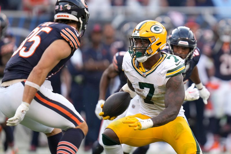 Green Bay Packers linebacker Quay Walker heads to the end zone for a touchdown after he intercepted a pass by Chicago Bears quarterback Justin Fields during the second half of an NFL football game Sunday, Sept. 10, 2023, in Chicago. (AP Photo/Erin Hooley)