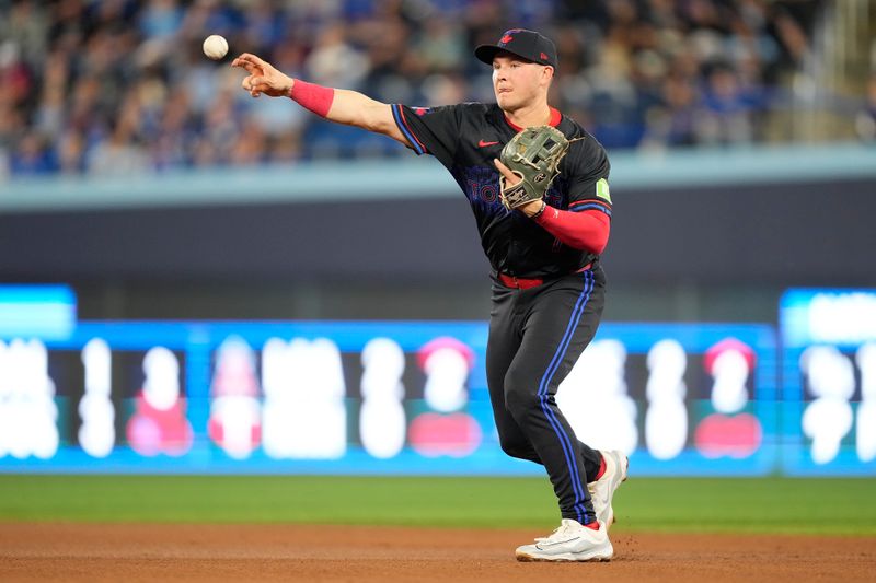Sep 9, 2024; Toronto, Ontario, CAN; Toronto Blue Jays second baseman Will Wagner (7) throws out New York Mets left fielder Brandon Nimmo (not pictured) at first during the fourth inning at Rogers Centre. Mandatory Credit: John E. Sokolowski-Imagn Images