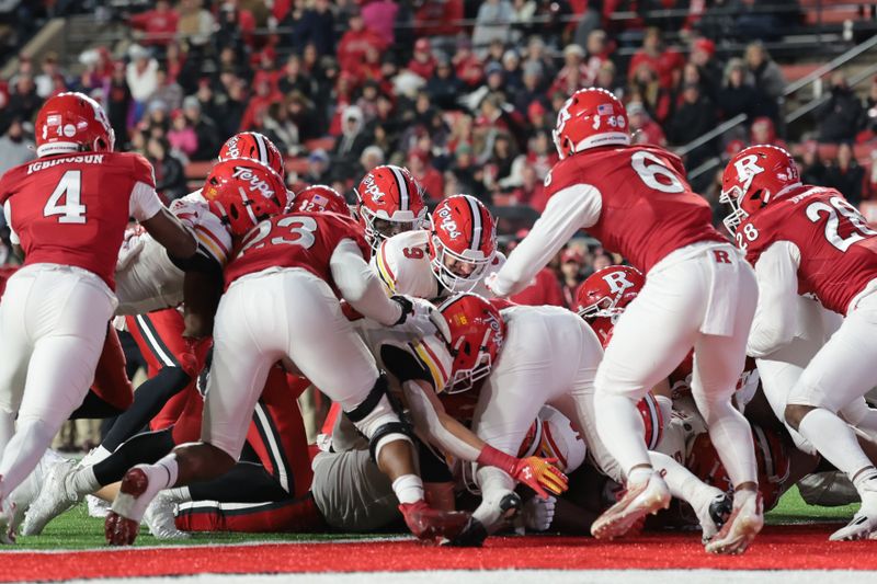 Nov 25, 2023; Piscataway, New Jersey, USA; Maryland Terrapins quarterback Billy Edwards Jr. (9) scores a rushing touchdown during the second half against the Rutgers Scarlet Knights at SHI Stadium. Mandatory Credit: Vincent Carchietta-USA TODAY Sports