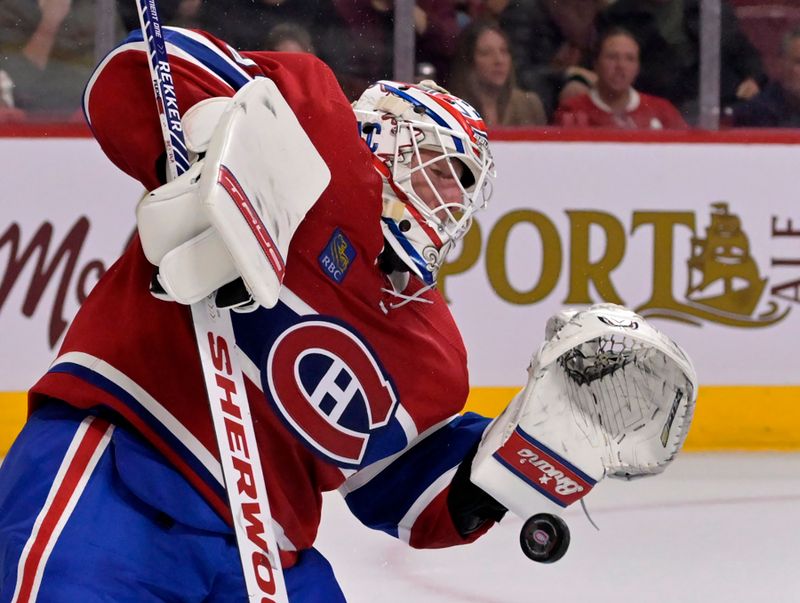 Oct 25, 2022; Montreal, Quebec, CAN; Montreal Canadiens goalie Jake Allen (34) makes a save during the first period of the game against the Minnesota Wild at the Bell Centre. Mandatory Credit: Eric Bolte-USA TODAY Sports