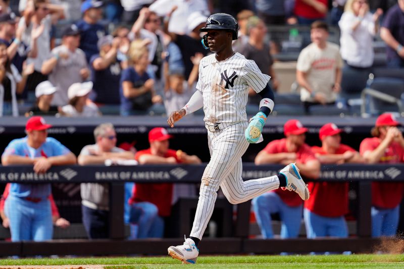 Aug 31, 2024; Bronx, New York, USA; New York Yankees third baseman Jazz Chisholm Jr. (13) scores a run on New York Yankees designated hitter Giancarlo Stanton (not pictured)) RBI double against the St. Louis Cardinals during the eighth inning at Yankee Stadium. Mandatory Credit: Gregory Fisher-USA TODAY Sports