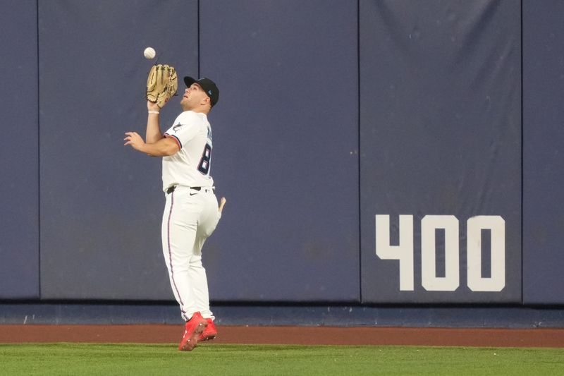 Sep 9, 2025; Miami, Florida, USA;  Miami Marlins center fielder Jakob Marsee (87) runs down a fly ball in the eighth inning against the Washington Nationals at loanDepot Park. Mandatory Credit: Jim Rassol-Imagn Images