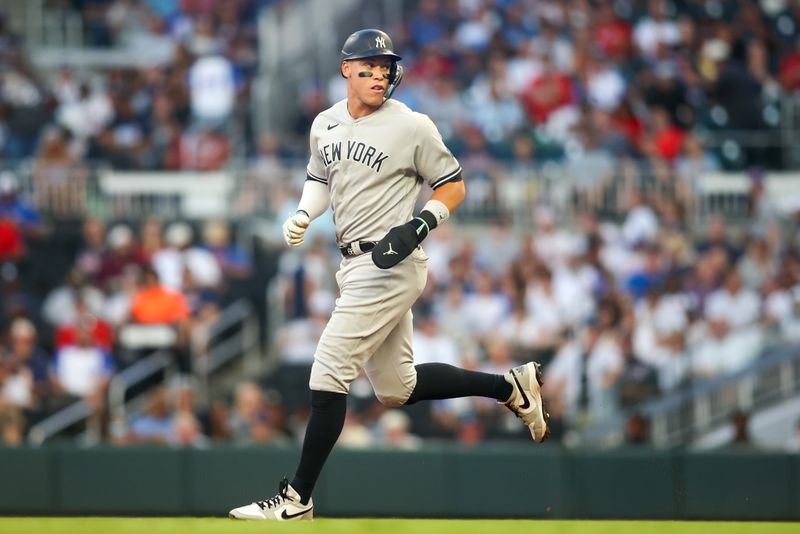 Aug 16, 2023; Atlanta, Georgia, USA; New York Yankees designated hitter Aaron Judge (99) runs to second against the Atlanta Braves in the fourth inning at Truist Park. Mandatory Credit: Brett Davis-USA TODAY Sports