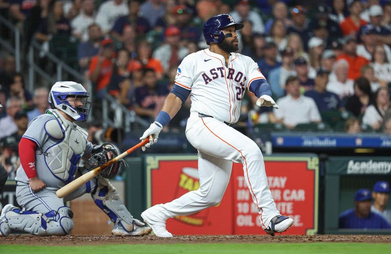 Apr 3, 2024; Houston, Texas, USA; Houston Astros first baseman Jon Singleton (28) hits a single during the third inning against the Toronto Blue Jays at Minute Maid Park. Mandatory Credit: Troy Taormina-USA TODAY Sports