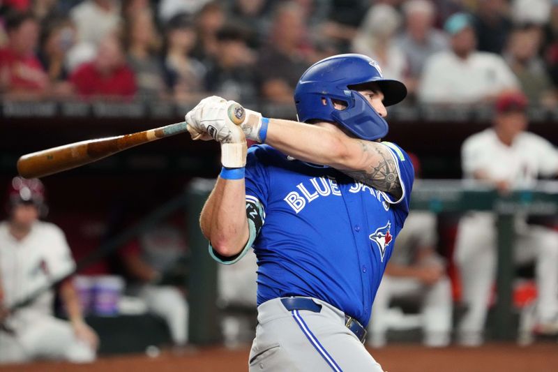 Jul 13, 2024; Phoenix, Arizona, USA; Toronto Blue Jays second base Spencer Horwitz (48) hits a double against the Arizona Diamondbacks during the sixth inning at Chase Field. Mandatory Credit: Joe Camporeale-USA TODAY Sports