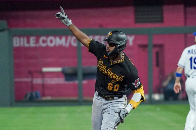 Aug 29, 2023; Kansas City, Missouri, USA; Pittsburgh Pirates shortstop Liover Peguero (60) celebrates against the Kansas City Royals while running the bases after hitting a three-run home run in the ninth inning at Kauffman Stadium. Mandatory Credit: Denny Medley-USA TODAY Sports