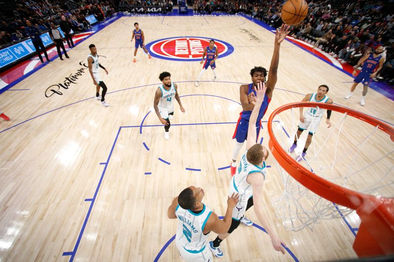 DETROIT, MI - March 11: James Wiseman #13 of the Detroit Pistons drives to the basket during the game against the Charlotte Hornets on March 11, 2024 at Little Caesars Arena in Detroit, Michigan. NOTE TO USER: User expressly acknowledges and agrees that, by downloading and/or using this photograph, User is consenting to the terms and conditions of the Getty Images License Agreement. Mandatory Copyright Notice: Copyright 2024 NBAE (Photo by Brian Sevald/NBAE via Getty Images)