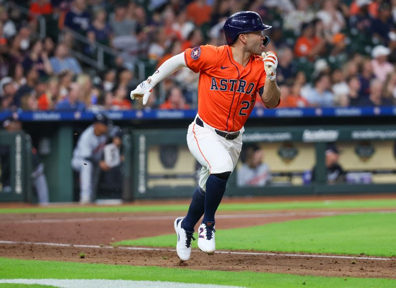 Jun 14, 2024; Houston, Texas, USA; Houston Astros second baseman Jose Altuve (27) hits a double against the Detroit Tigers in the sixth inning at Minute Maid Park. Mandatory Credit: Thomas Shea-USA TODAY Sports