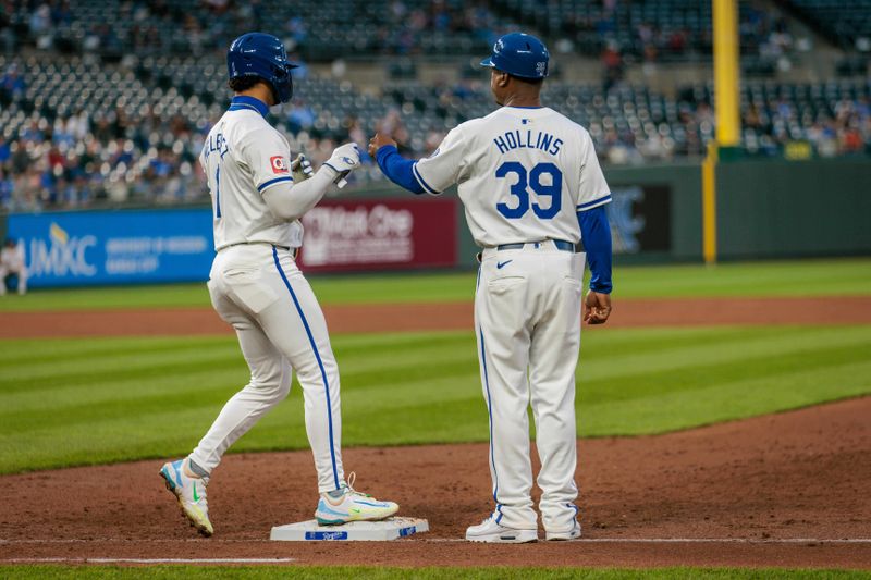 Apr 10, 2024; Kansas City, Missouri, USA; Kansas City Royals outfielder MJ Melendez (1) fist bumps Kansas City Royals first base coach Damon Hollins (39) after a hit during the third inning against the Houston Astros at Kauffman Stadium. Mandatory Credit: William Purnell-USA TODAY Sports