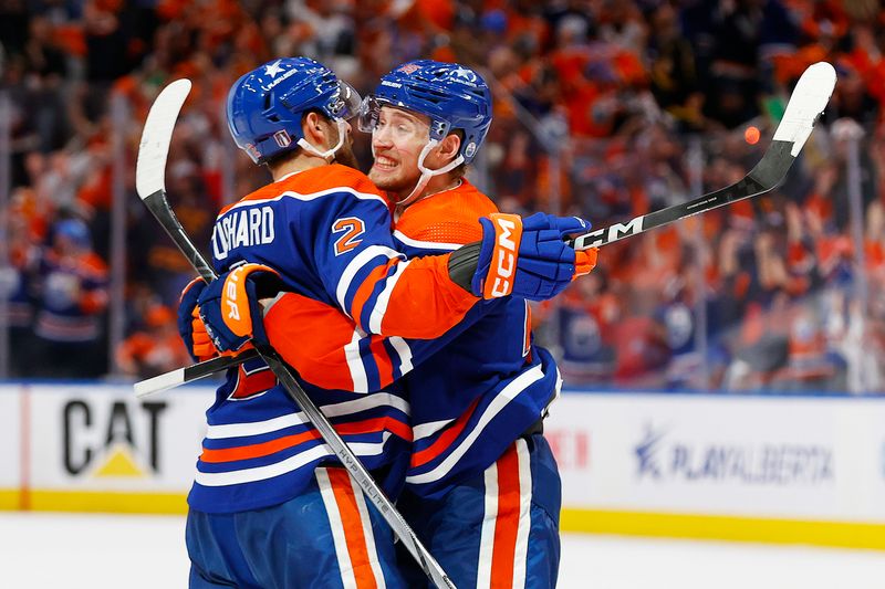 May 14, 2024; Edmonton, Alberta, CAN; The Edmonton Oilers celebrate a goal scored by defensemen Evan Bouchard (2) during the third period against the Vancouver Canucks in game four of the second round of the 2024 Stanley Cup Playoffs at Rogers Place. Mandatory Credit: Perry Nelson-USA TODAY Sports