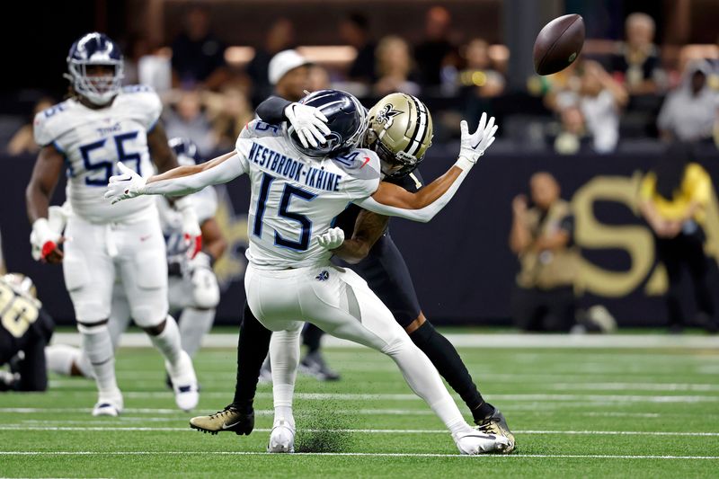 New Orleans Saints cornerback Alontae Taylor (1) breaks up a pass intended for Tennessee Titans wide receiver Nick Westbrook-Ikhine (15) during an NFL football game, Sunday, Sep. 10, 2023, in New Orleans. (AP Photo/Tyler Kaufman)