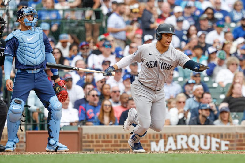 Sep 6, 2024; Chicago, Illinois, USA; New York Yankees outfielder Juan Soto (22) singles against the Chicago Cubs during the third inning at Wrigley Field. Mandatory Credit: Kamil Krzaczynski-Imagn Images