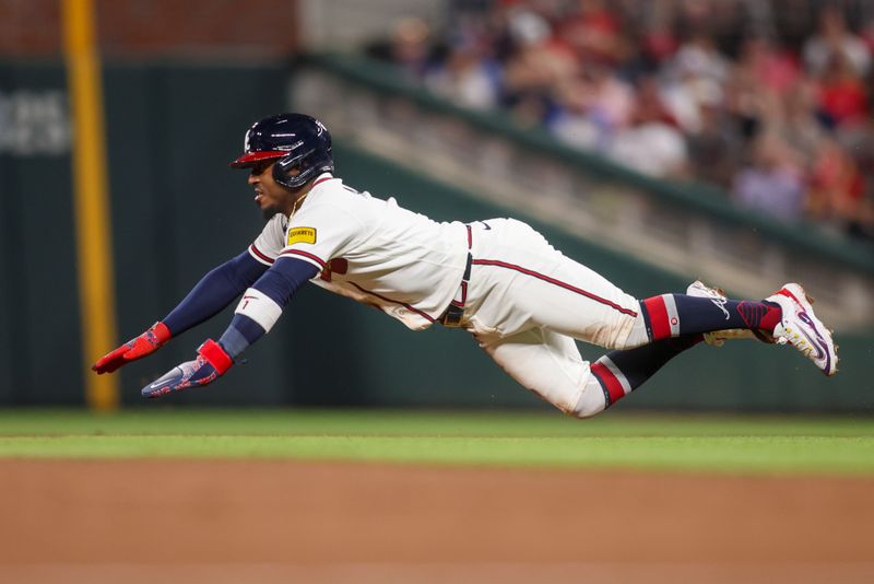 Mar 27, 2026; Atlanta, Georgia, USA; Atlanta Braves second baseman Ozzie Albies (1) slides into second base against the Kansas City Royals in the third inning at Truist Park. Mandatory Credit: Brett Davis-Imagn Images
Mar 27, 2026; Atlanta, Georgia, USA; Atlanta Braves second baseman Ozzie Albies (1) slides into second base against the Kansas City Royals in the third inning at Truist Park. Mandatory Credit: Brett Davis-Imagn Images
