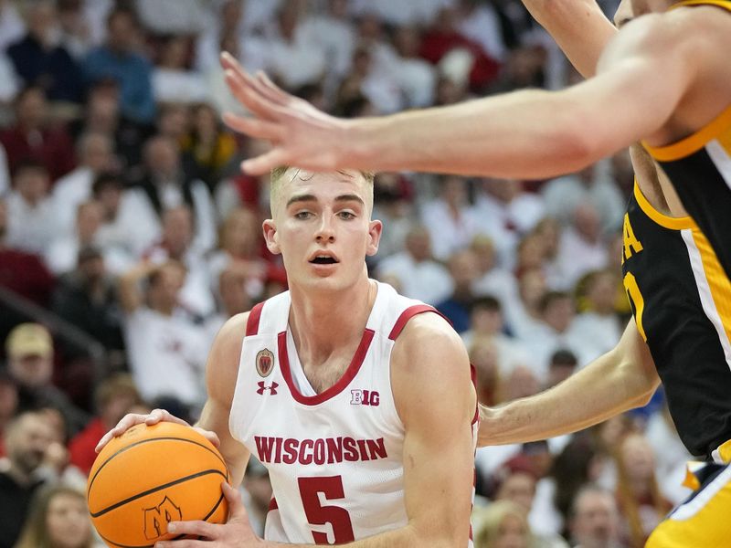 Feb 22, 2023; Madison, Wisconsin, USA; Wisconsin Badgers forward Tyler Wahl (5) looks to pass during the second half against the Iowa Hawkeyes at the Kohl Center. Mandatory Credit: Kayla Wolf-USA TODAY Sports