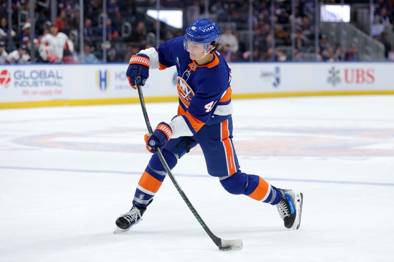 Oct 11, 2025; Elmont, New York, USA; New York Islanders defenseman Matthew Schaefer (48) takes a shot against the Washington Capitals during the second period at UBS Arena. Mandatory Credit: Brad Penner-Imagn Images