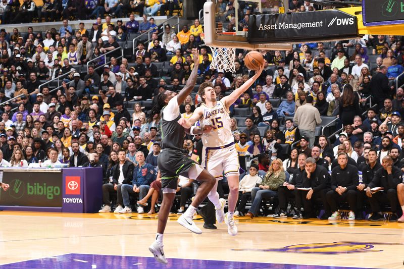 LOS ANGELES, CA - APRIL 7: Austin Reaves #15 of the Los Angeles Lakers drives to the basket during the game against the Minnesota Timberwolves on April 7, 2024 at Crypto.Com Arena in Los Angeles, California. NOTE TO USER: User expressly acknowledges and agrees that, by downloading and/or using this Photograph, user is consenting to the terms and conditions of the Getty Images License Agreement. Mandatory Copyright Notice: Copyright 2024 NBAE (Photo by Juan Ocampo/NBAE via Getty Images)