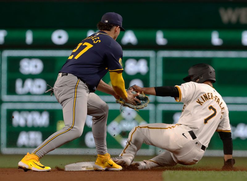 Sep 25, 2024; Pittsburgh, Pennsylvania, USA;  Pittsburgh Pirates third baeman Isiah Kiner-Falefa (7) steals second base ahead of a tag attempt by Milwaukee Brewers shortstop Willy Adames (27) during the fourth inning at PNC Park. Mandatory Credit: Charles LeClaire-Imagn Images