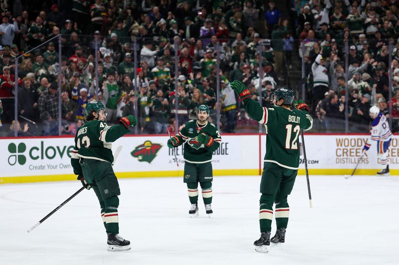 Dec 20, 2025; Saint Paul, Minnesota, USA; Minnesota Wild left wing Matt Boldy (12) celebrates his goal against the Edmonton Oilers during the first period at Grand Casino Arena. Mandatory Credit: Matt Krohn-Imagn Images