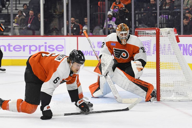 Nov 25, 2024; Philadelphia, Pennsylvania, USA; Philadelphia Flyers defenseman Travis Sanheim (6) defends with goaltender Ivan Fedotov (82) against the Vegas Golden Knights during the second period at Wells Fargo Center. Mandatory Credit: Eric Hartline-Imagn Images