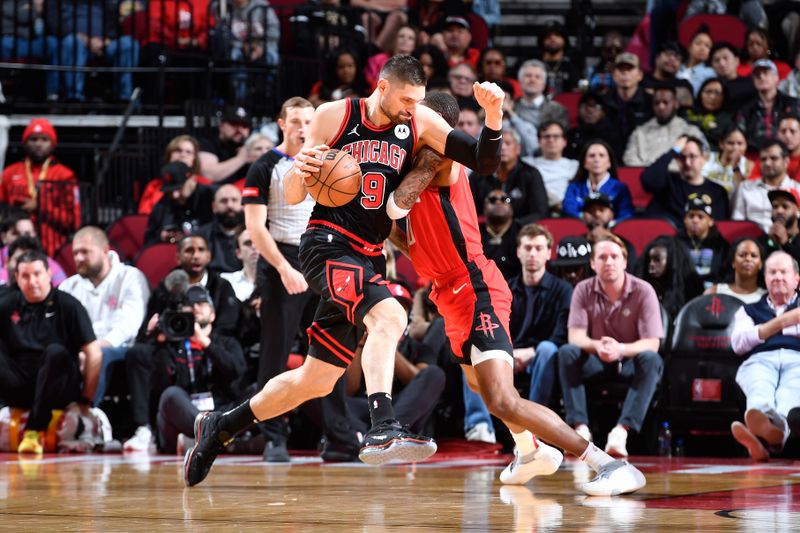 HOUSTON, TX - MARCH 21:   Nikola Vucevic #9 of the Chicago Bulls handles the ball during the game against the Houston Rockets on March 21, 2024 at the Toyota Center in Houston, Texas. NOTE TO USER: User expressly acknowledges and agrees that, by downloading and or using this photograph, User is consenting to the terms and conditions of the Getty Images License Agreement. Mandatory Copyright Notice: Copyright 2024 NBAE (Photo by Logan Riely/NBAE via Getty Images)