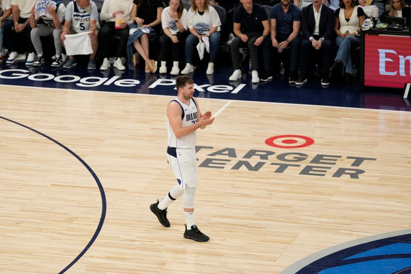 MINNEAPOLIS, MN - MAY 30: Luka Doncic #77 of the Dallas Mavericks celebrates during the game against the Minnesota Timberwolves during Game 5 of the Western Conference Finals of the 2024 NBA Playoffs on May 30, 2024 at Target Center in Minneapolis, Minnesota. NOTE TO USER: User expressly acknowledges and agrees that, by downloading and or using this Photograph, user is consenting to the terms and conditions of the Getty Images License Agreement. Mandatory Copyright Notice: Copyright 2024 NBAE (Photo by Jordan Johnson/NBAE via Getty Images)