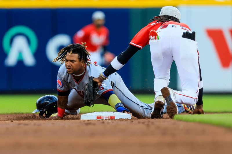 May 17, 2025; Cincinnati, Ohio, USA; Cincinnati Reds shortstop Elly De La Cruz (44) tags Cleveland Guardians third baseman Jose Ramirez (11) out at second on a steal in the third inning at Great American Ball Park. Mandatory Credit: Katie Stratman-Imagn Images