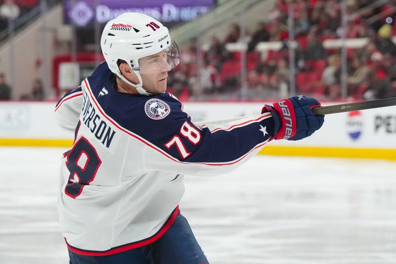 Dec 9, 2025; Raleigh, North Carolina, USA;  Columbus Blue Jackets defenseman Damon Severson (78) takes a shot against the Carolina Hurricanes during the second period at Lenovo Center. Mandatory Credit: James Guillory-Imagn Images