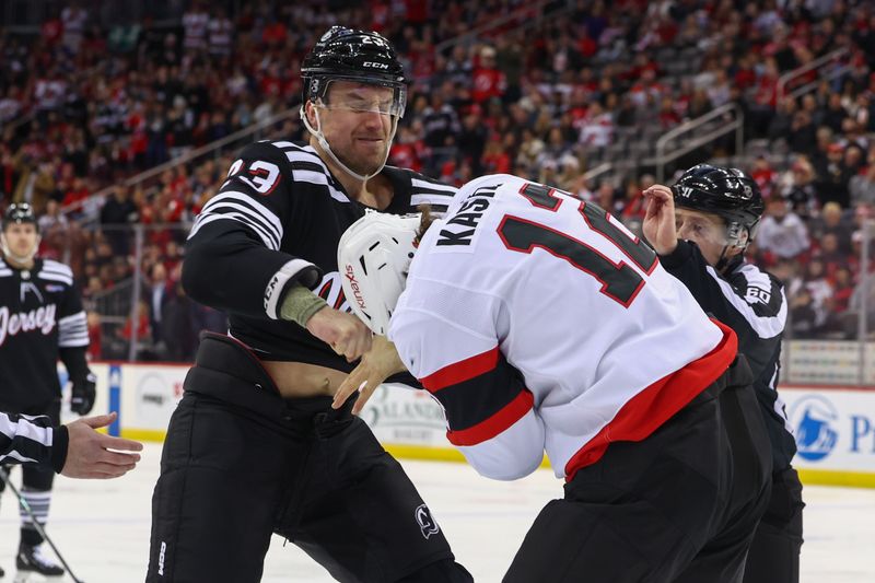 Mar 23, 2024; Newark, New Jersey, USA; New Jersey Devils defenseman Kurtis MacDermid (23) and Ottawa Senators center Mark Kastelic (12) fight during the first period at Prudential Center. Mandatory Credit: Ed Mulholland-USA TODAY Sports