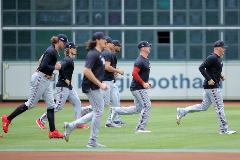 Oct 8, 2023; Houston, Texas, USA; The Minnesota Twins warm up before game two of the ALDS for the 2023 MLB playoffs at Minute Maid Park. Mandatory Credit: Erik Williams-USA TODAY Sports