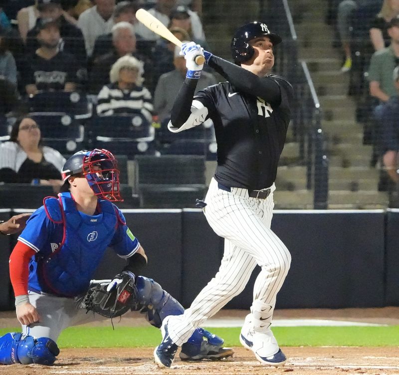 Feb 28, 2025; Tampa, Florida, USA; New York Yankees outfielder Cody Bellinger (35) hits a home run against the Toronto Blue Jays during the first inning at George M. Steinbrenner Field. Mandatory Credit: Dave Nelson-Imagn Images