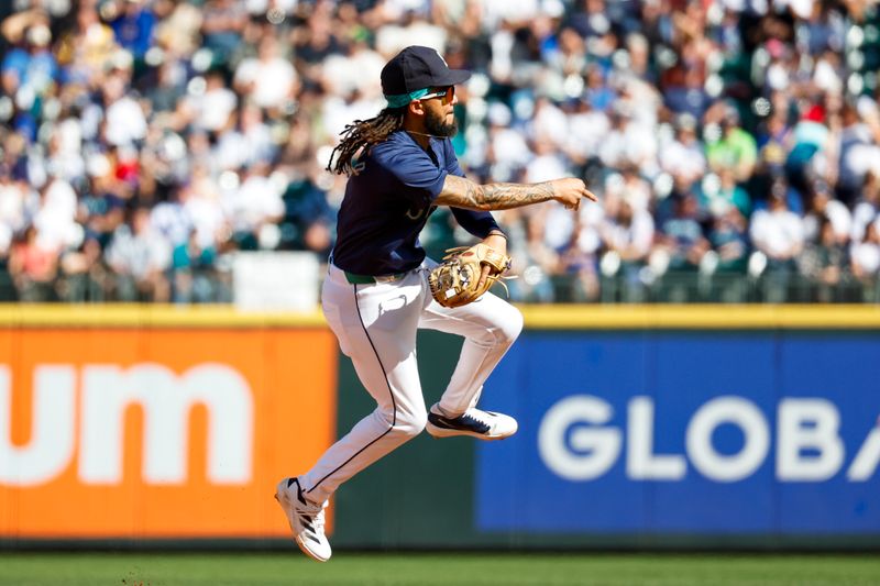 Sep 19, 2024; Seattle, Washington, USA; Seattle Mariners shortstop J.P. Crawford (3) throws to first base during the sixth inning against the New York Yankees at T-Mobile Park. Mandatory Credit: Joe Nicholson-Imagn Images