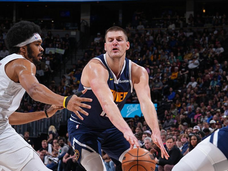 DENVER, CO - MARCH 31: Nikola Jokic #15 of the Denver Nuggets passes the ball during the game against the Cleveland Cavaliers on March 31, 2024 at the Ball Arena in Denver, Colorado. NOTE TO USER: User expressly acknowledges and agrees that, by downloading and/or using this Photograph, user is consenting to the terms and conditions of the Getty Images License Agreement. Mandatory Copyright Notice: Copyright 2024 NBAE (Photo by Garrett Ellwood/NBAE via Getty Images)