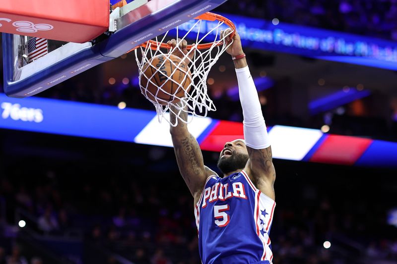 PHILADELPHIA, PENNSYLVANIA - DECEMBER 11: Marcus Morris Sr. #5 of the Philadelphia 76ers dunks during the third quarter against the Washington Wizards at the Wells Fargo Center on December 11, 2023 in Philadelphia, Pennsylvania. (Photo by Tim Nwachukwu/Getty Images)