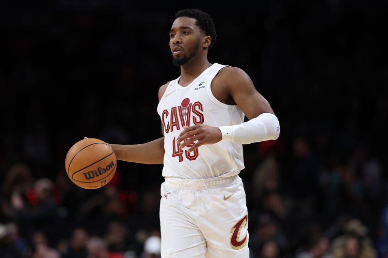 WASHINGTON, DC - FEBRUARY 25: Donovan Mitchell #45 of the Cleveland Cavaliers dribbles against the Washington Wizards during the second half at Capital One Arena on February 25, 2024 in Washington, DC. NOTE TO USER: User expressly acknowledges and agrees that, by downloading and or using this photograph, User is consenting to the terms and conditions of the Getty Images License Agreement. (Photo by Patrick Smith/Getty Images)