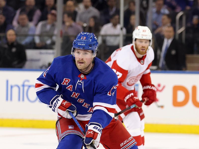 Nov 29, 2023; New York, New York, USA; New York Rangers left wing Alexis Lafreniere (13) skates with the puck against the Detroit Red Wings during the third period at Madison Square Garden. Mandatory Credit: Brad Penner-USA TODAY Sports