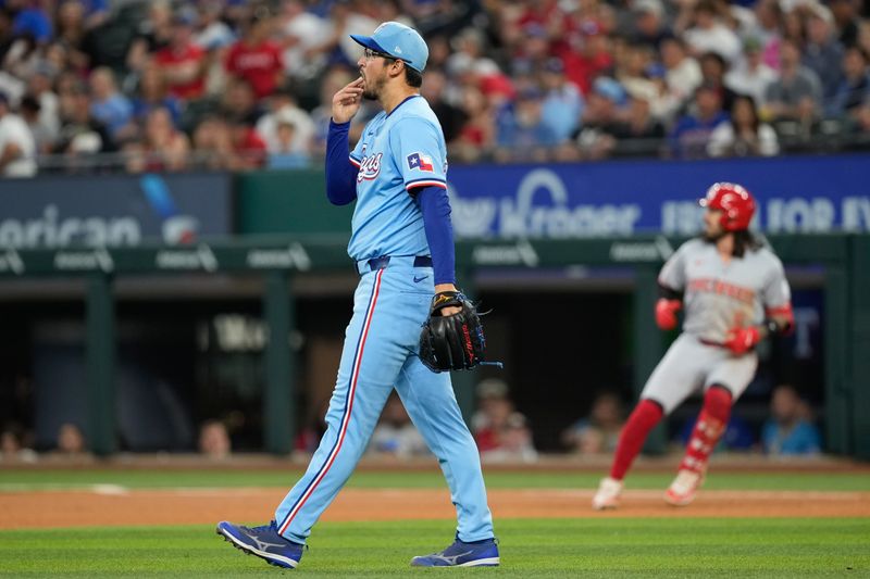 Apr 28, 2024; Arlington, Texas, USA; Texas Rangers starting pitcher Dane Dunning (33) looks to the outfield after giving up his first hit against the Cincinnati Reds during the fifth inning at Globe Life Field. Mandatory Credit: Jim Cowsert-USA TODAY Sports