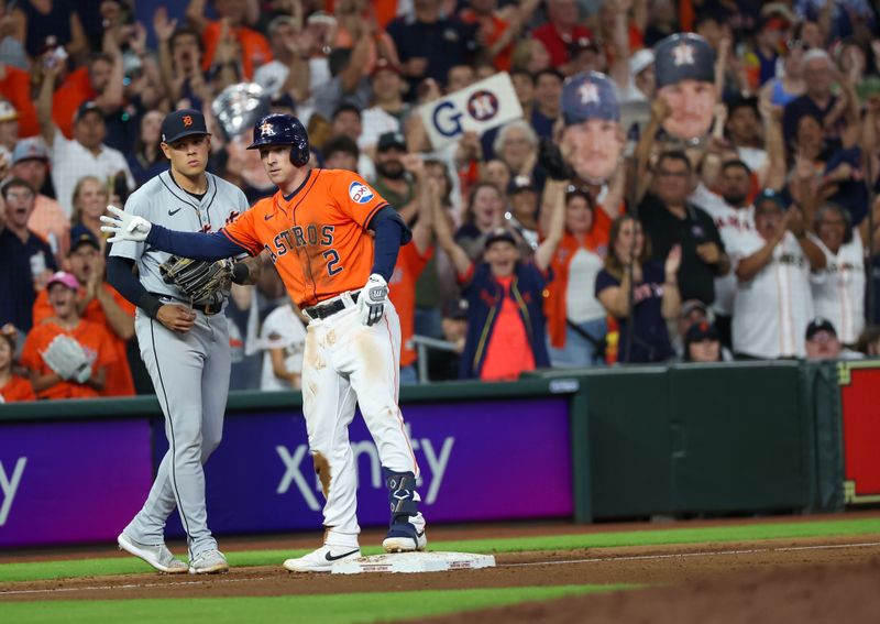 Jun 14, 2024; Houston, Texas, USA;  Houston Astros third baseman Alex Bregman (2) reacts to his RBI triple against the Detroit Tigers in the sixth inning at Minute Maid Park. Mandatory Credit: Thomas Shea-USA TODAY Sports