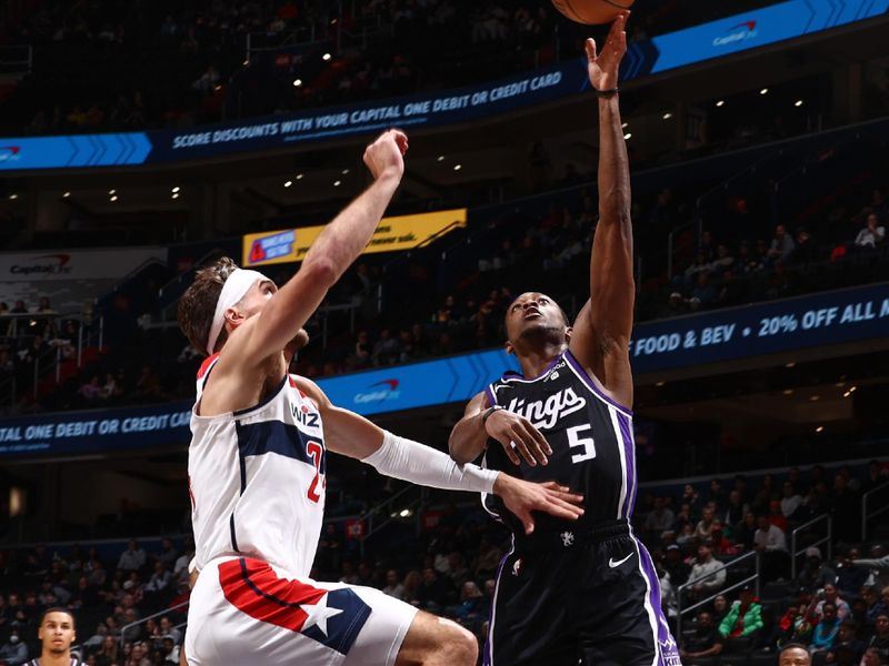 WASHINGTON, DC -? MARCH 21:  De'Aaron Fox #5 of the Sacramento Kings goes to the basket during the game on March 21, 2024 at Capital One Arena in Washington, DC. NOTE TO USER: User expressly acknowledges and agrees that, by downloading and or using this Photograph, user is consenting to the terms and conditions of the Getty Images License Agreement. Mandatory Copyright Notice: Copyright 2024 NBAE (Photo by Kenny Giarla/NBAE via Getty Images)