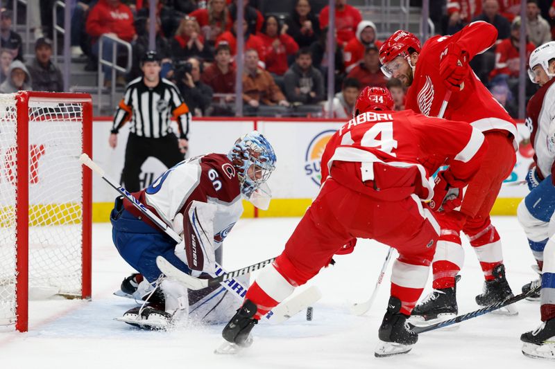 Feb 22, 2024; Detroit, Michigan, USA;  Detroit Red Wings center Robby Fabbri (14) tries to score on Colorado Avalanche goaltender Justus Annunen (60) in the second period at Little Caesars Arena. Mandatory Credit: Rick Osentoski-USA TODAY Sports