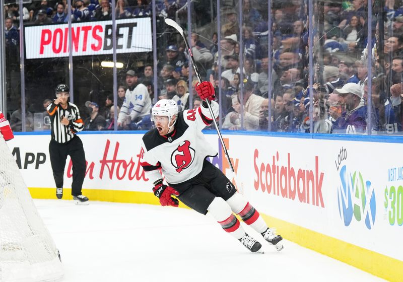 Mar 26, 2024; Toronto, Ontario, CAN; New Jersey Devils center Max Willman (46) celebrates scoring a goal against the Toronto Maple Leafs during the second period at Scotiabank Arena. Mandatory Credit: Nick Turchiaro-USA TODAY Sports