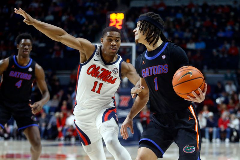 Jan 10, 2024; Oxford, Mississippi, USA; Florida Gators guard Walter Clayton Jr. (1) drives to the basket as Mississippi Rebels guard Matthew Murrell (11) defends during the first half at The Sandy and John Black Pavilion at Ole Miss. Mandatory Credit: Petre Thomas-USA TODAY Sports