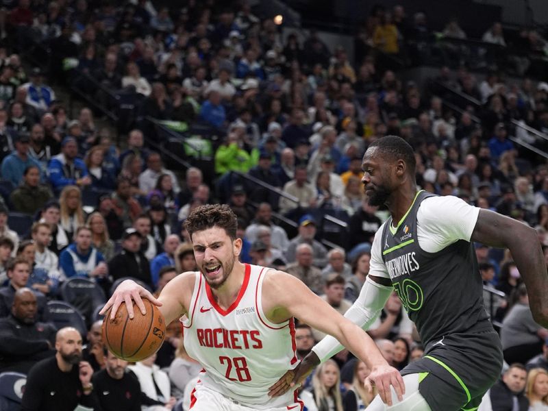 MINNEAPOLIS, MN -  NOVEMBER 26: Alperen Sengun #28 of the Houston Rockets drives to the basket during the game against the Minnesota Timberwolves during the Emirates NBA Cup game on November 26, 2024 at Target Center in Minneapolis, Minnesota. NOTE TO USER: User expressly acknowledges and agrees that, by downloading and or using this Photograph, user is consenting to the terms and conditions of the Getty Images License Agreement. Mandatory Copyright Notice: Copyright 2024 NBAE (Photo by Jordan Johnson/NBAE via Getty Images)